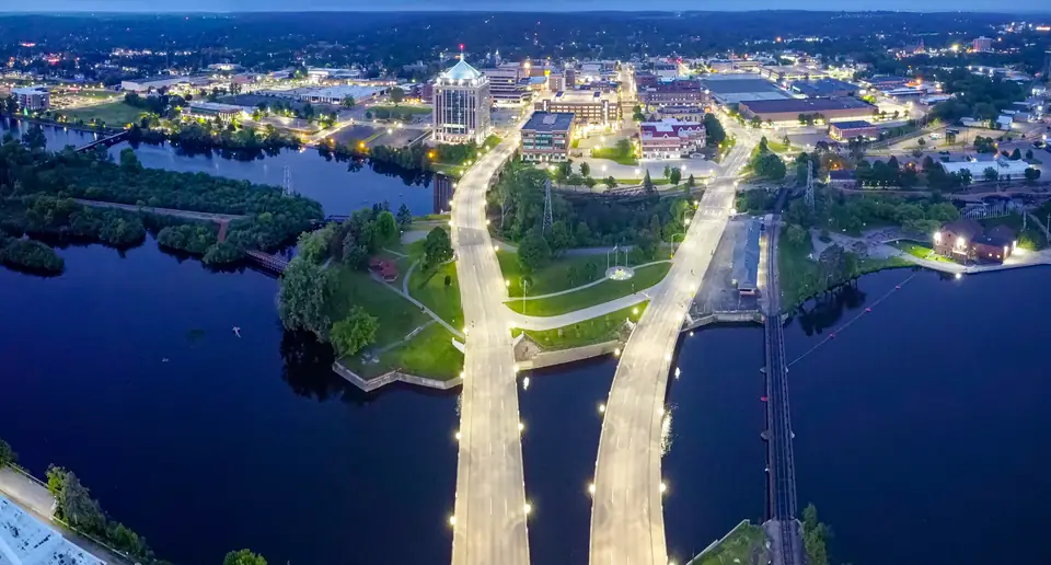 Downtown Wausau and the Wisconsin River bridges at dusk, seen from above